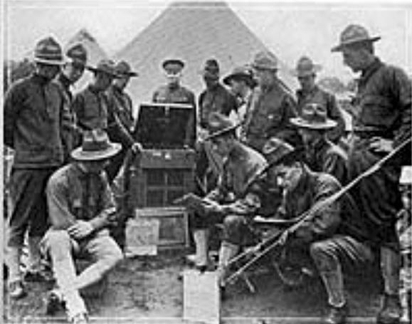 Soldiers gather around phonograph