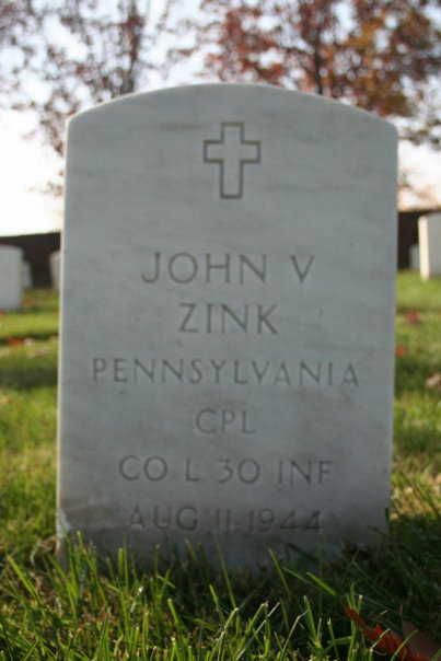The gravestone of Corporal John Vincent Zink, CO L, 30th Infantry Regiment, US Army, in Arlington National Cemetery Section 17, Site 23169-1A; FindAGrave Memorial ID 34784620; His wife, Ann, is buried with him and her name is inscribed on the reverse of this gravestone. 