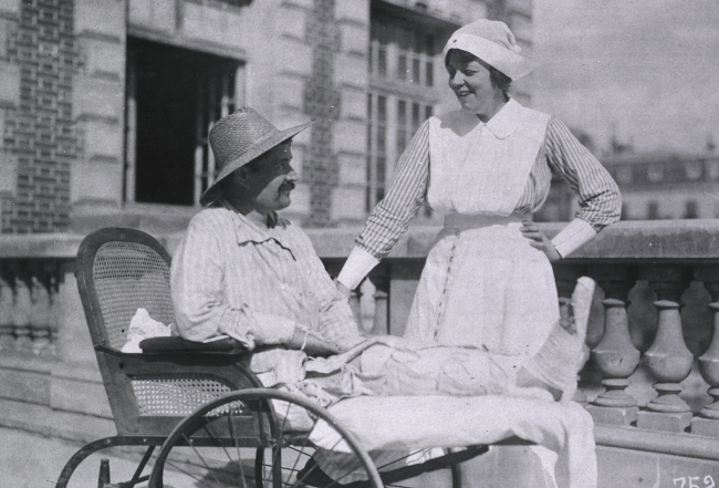 American nurse talking to a French patient at Red Cross Hospital No. 1.