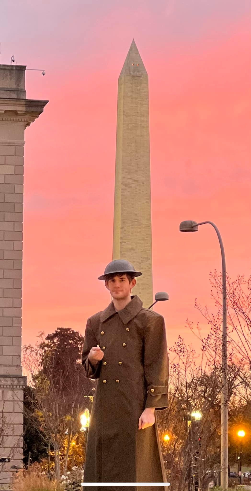 Matthew Barker in front of Washington Monument at sunset