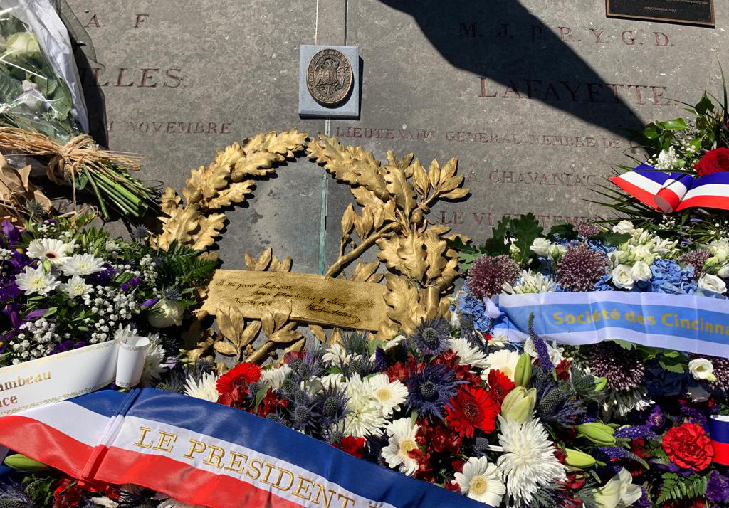 Golden wreath and floral wreaths on display