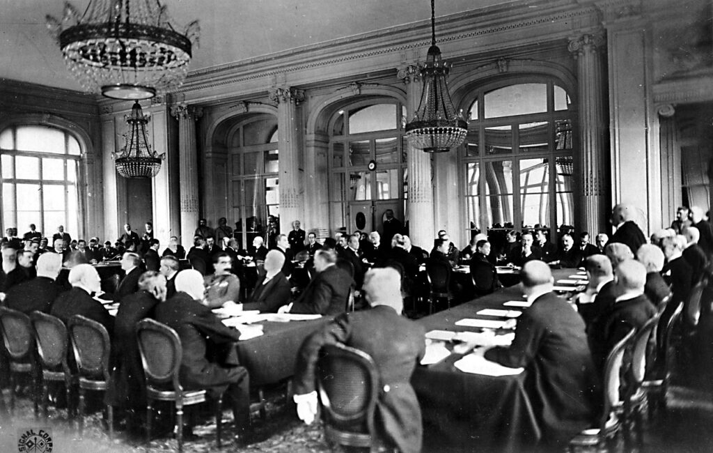 a large group of politicians sitting around a table