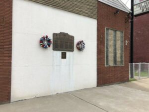 War memorial and wreaths on a wall