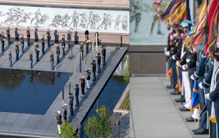 The U.S. Army Band "Pershing's Own" plays as the Star Spangled Banner is raised for the first time over the new National World War I Memorial in Washington, DC.